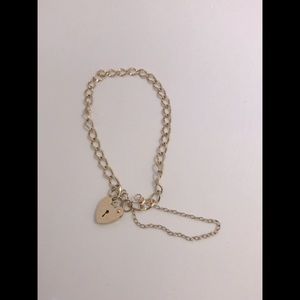 Very unique gold bracelet with heart lock